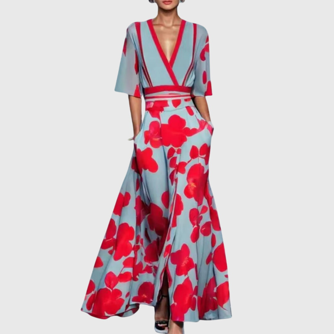 Beautiful women's floral spring dress with vibrant red, white, green print. A flowy, elegant midi A-line design.