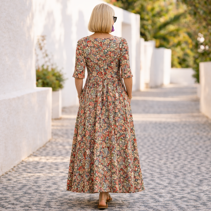Flowy women's elegant floral midi dress, ideal for summer parties and special occasions, featuring a beautiful print.