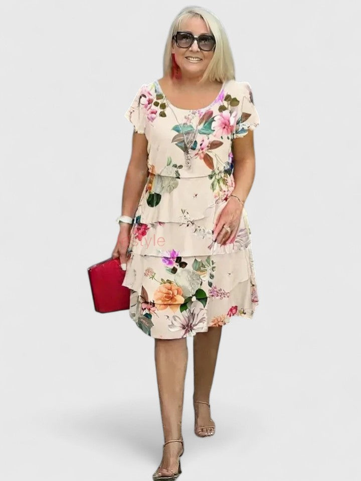 Chic & comfortable women's floral tiered dress with short sleeves, ideal for versatile summer fashion.