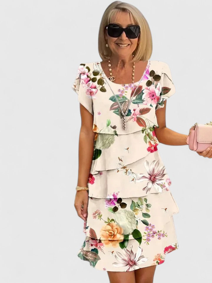 Women's short sleeve floral tiered dress, elegant & comfortable for any summer day or party event.