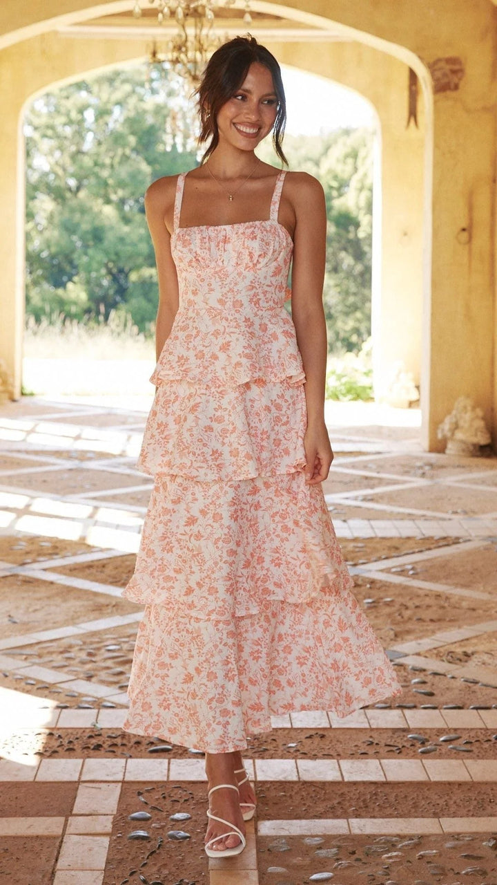 Elegant women's floral tiered maxi dress, perfect for a wedding guest, with a flowing silhouette.