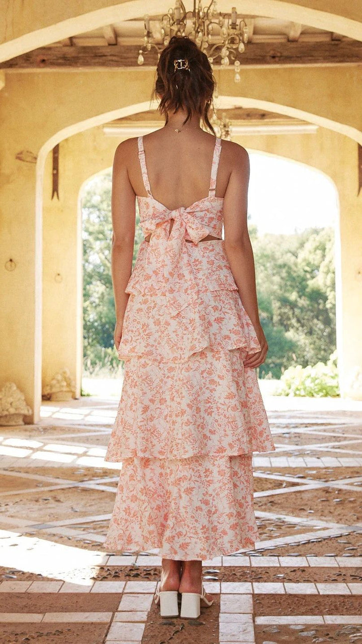 Long floral print maxi dress for women, featuring a chic tiered design, perfect for elegant gatherings.