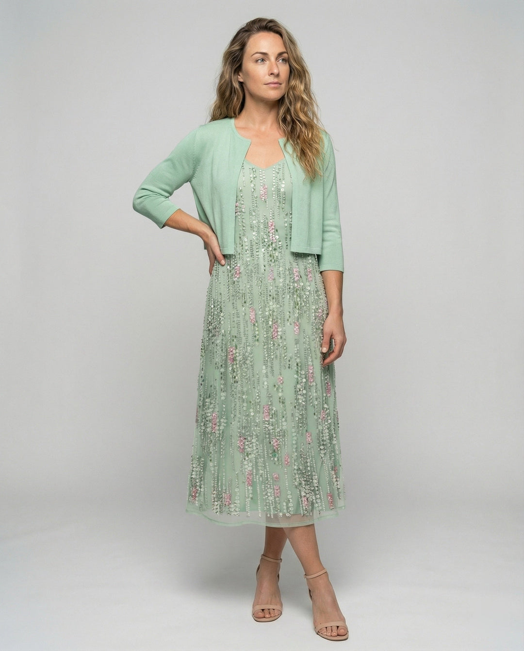 Elegant women's floral two-piece midi dress. Perfect summer fashion for special occasions. Feminine coordinated style.