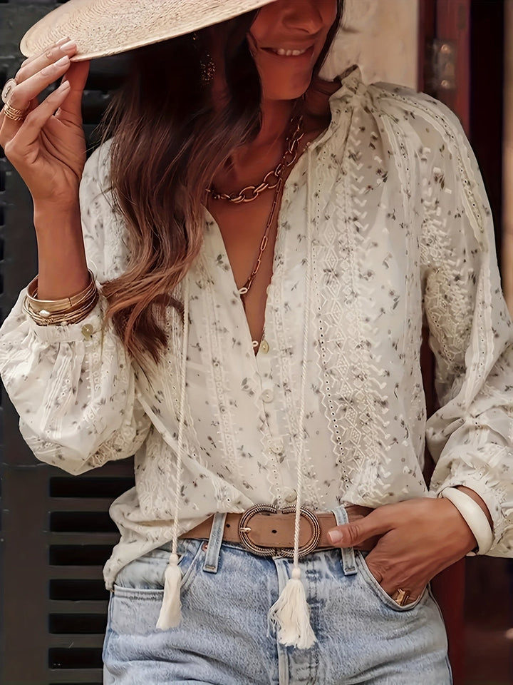 Chic women's floral print V-neck blouse, versatile for all seasons. Elegant top for casual or workwear style.