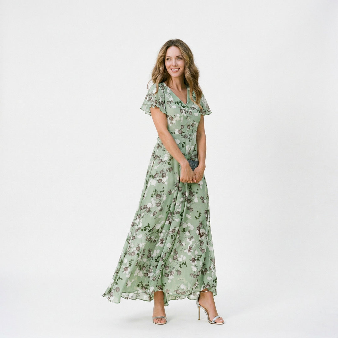 Full-length shot of a flowing floral V-neck maxi dress, designed for wedding guest attire.