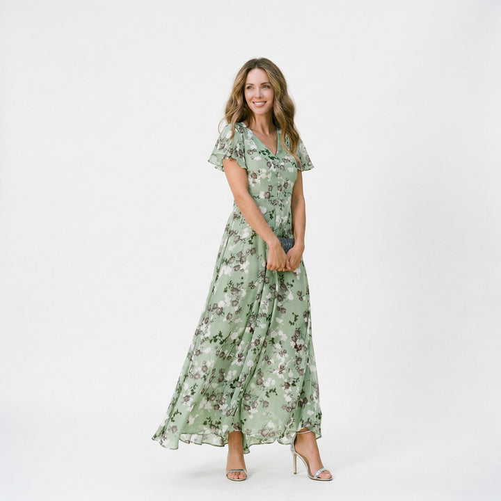 Full-length shot of a flowing floral V-neck maxi dress, designed for wedding guest attire.