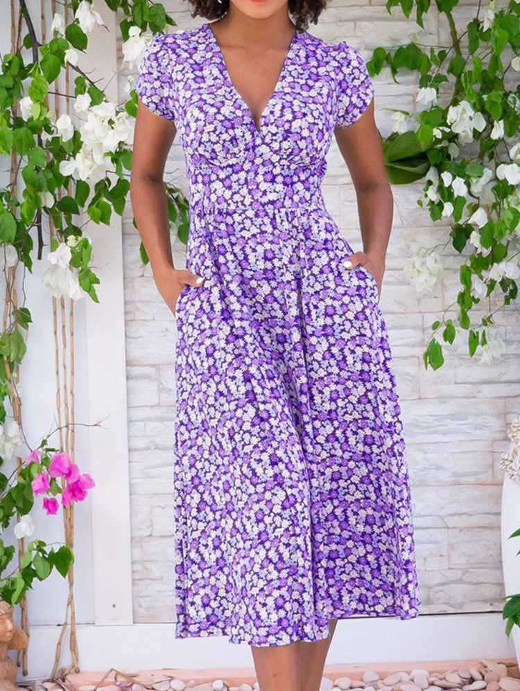 Vibrant floral print women's short sleeve midi dress with a V-neck, offering a flowy, elegant silhouette.