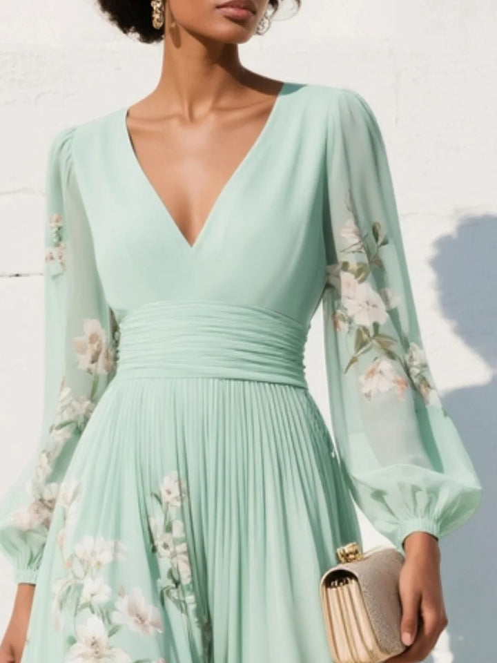Beautiful floral print V-neck midi dress for women, featuring a pleated skirt, great for wedding occasions.