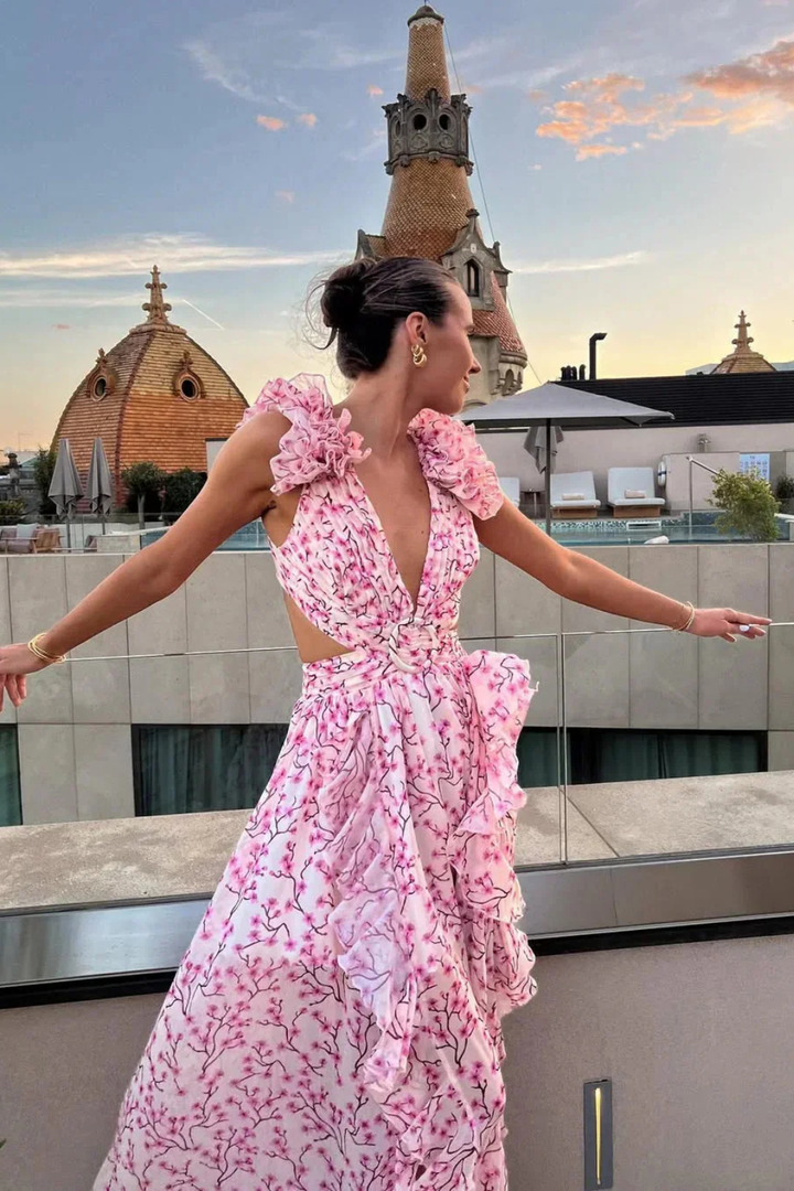 Beautiful floral print V-neck maxi dress for women, featuring elegant ruffles, suitable for wedding guests.