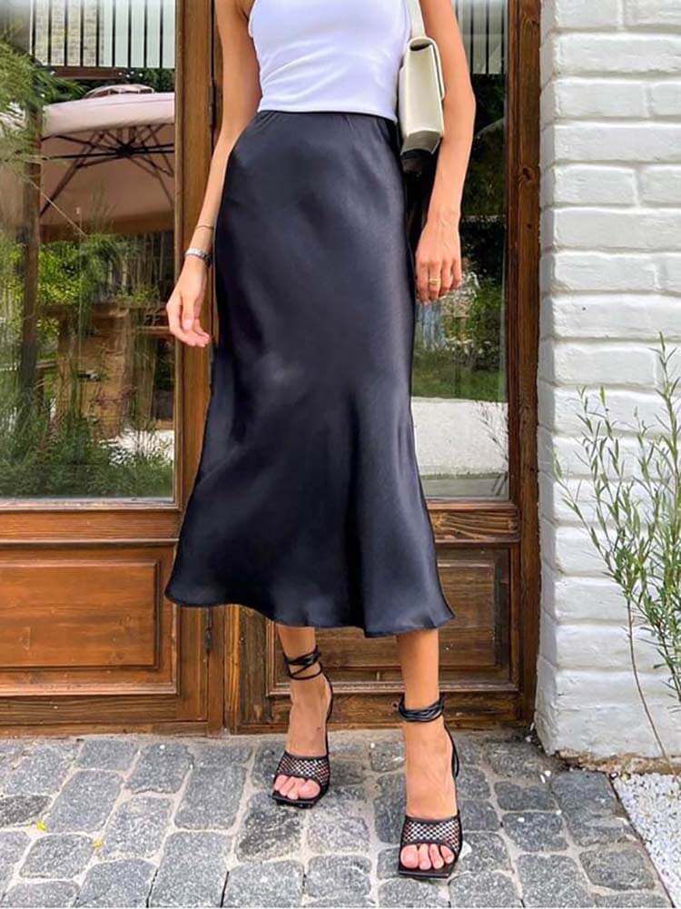 Elegant women's flowing A-line midi skirt, perfect for versatile day-to-night fashion.