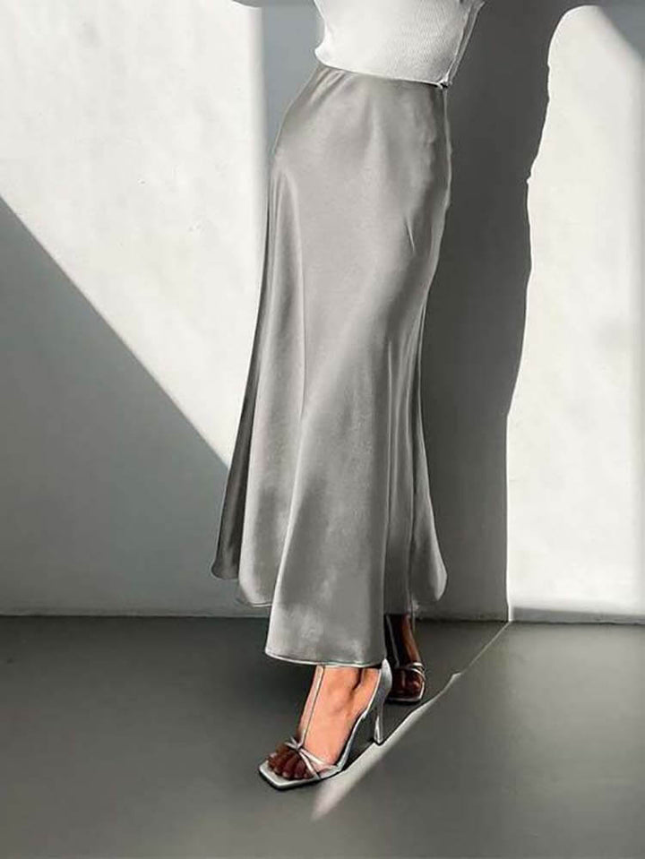 Women's A-line midi skirt with flowing fabric, an elegant and versatile addition to any wardrobe.