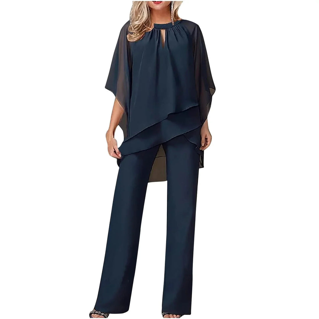 Elegant women's flowing batwing-sleeve top and wide-leg pants set, perfect for formal occasions. Loose fit.