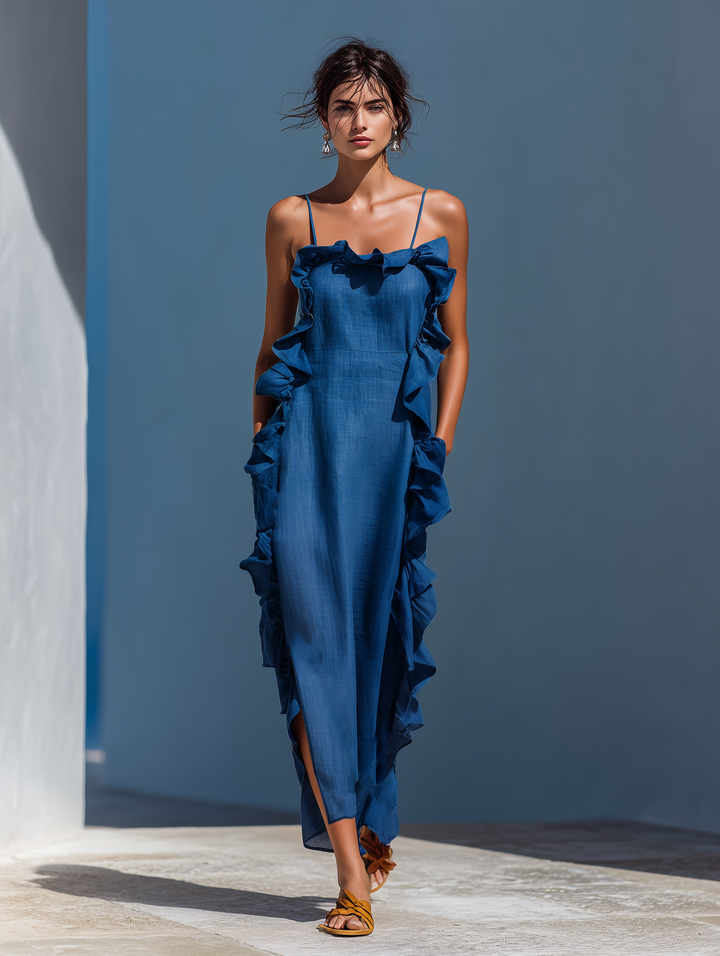Elegant women's flowing maxi dress with delicate straps, perfect for summer vacation or versatile evening wear.