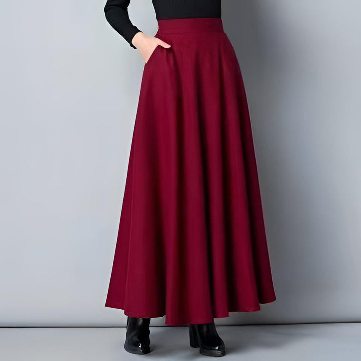 Elegant women's flowing maxi skirt with pockets, perfect for spring/summer comfort and style.