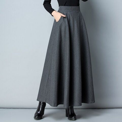 High-waist women's long maxi skirt with practical pockets, ideal for casual or formal elegant fashion.