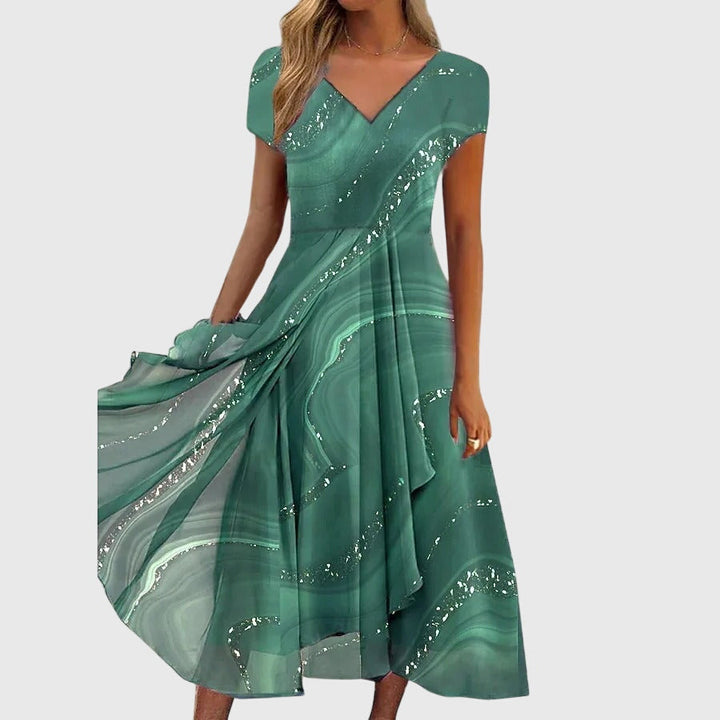 Chic women's V-neck midi dress for effortless spring & summer style. Flowing fabric ensures comfortable, elegant wear.