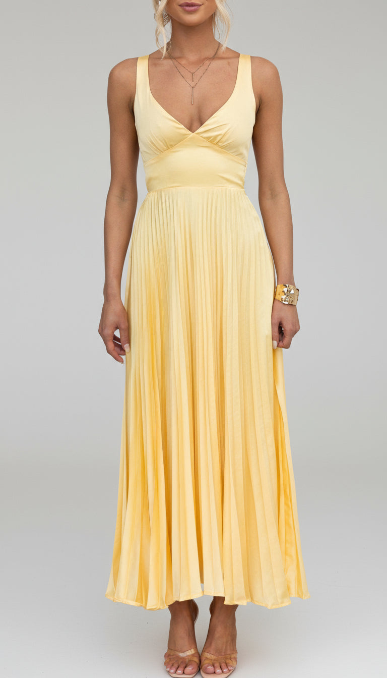 Women's elegant summer V-neck pleated maxi dress. Flowing design ideal for occasion wear, feminine fashion.