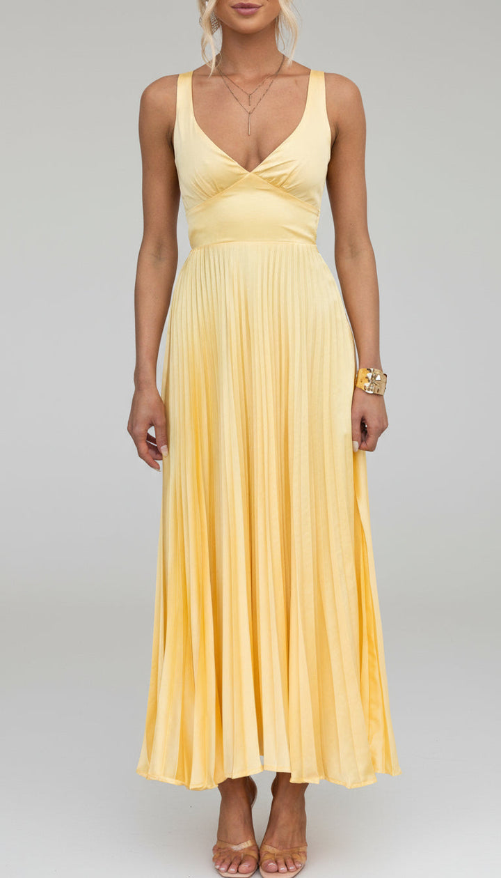Women's elegant summer V-neck pleated maxi dress. Flowing design ideal for occasion wear, feminine fashion.