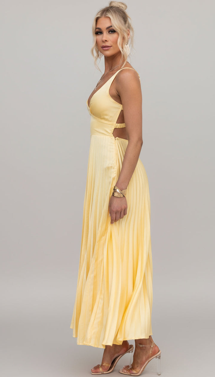 Lightweight flowing pleated V-neck maxi dress for women. Elegant summer style, comfortable for any special occasion.