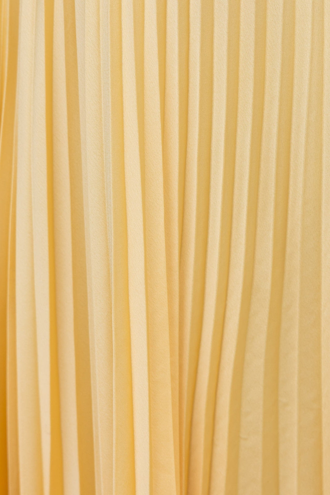 Long elegant women's V-neck pleated maxi dress. Flowing fabric, perfect summer style for sophisticated occasion wear.