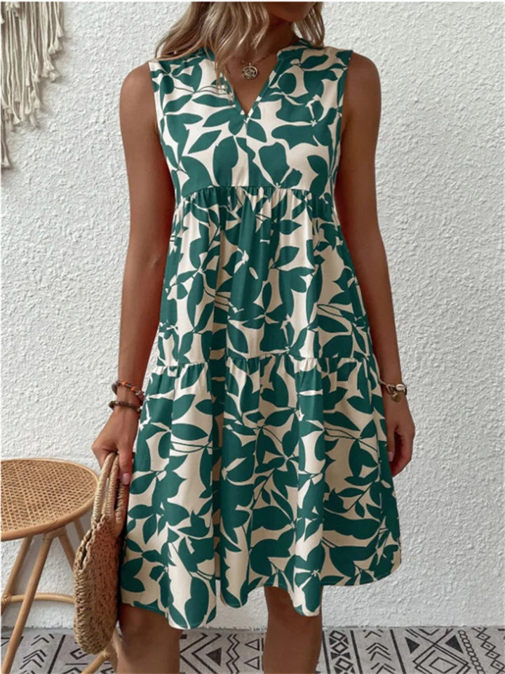 Elegant women's flowy floral midi dress, perfect for summer parties. Features a flattering V-neck and A-line silhouette.