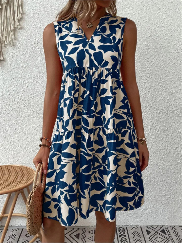 Sleeveless floral midi dress for women, ideal for elegant summer events & occasion wear. Features a flowy A-line design.