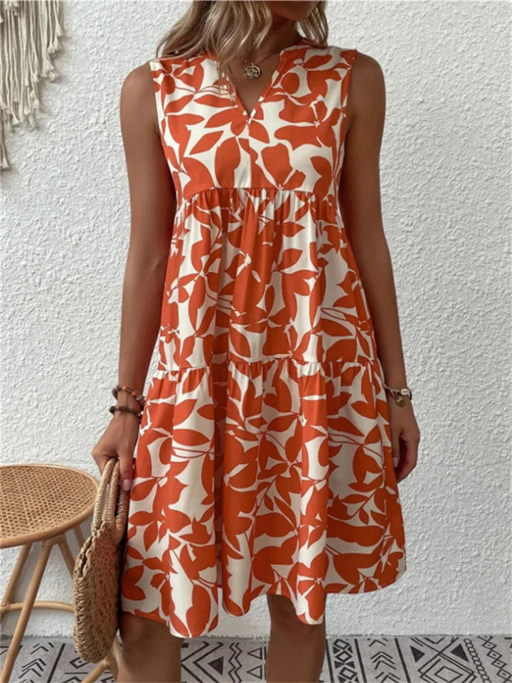 Chic women's V-neck floral midi dress with a flowy A-line cut, perfect for summer outings and elegant wear.