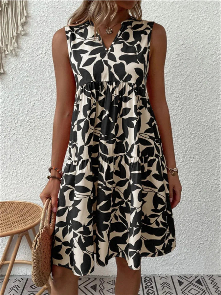 Beautiful women's elegant floral summer midi dress. Flowy sleeveless design with a V-neck, suitable for parties.