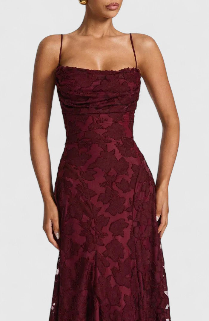 Sophisticated women's maxi dress with an elegant open back, flowy silhouette, and stylish cowl neck.