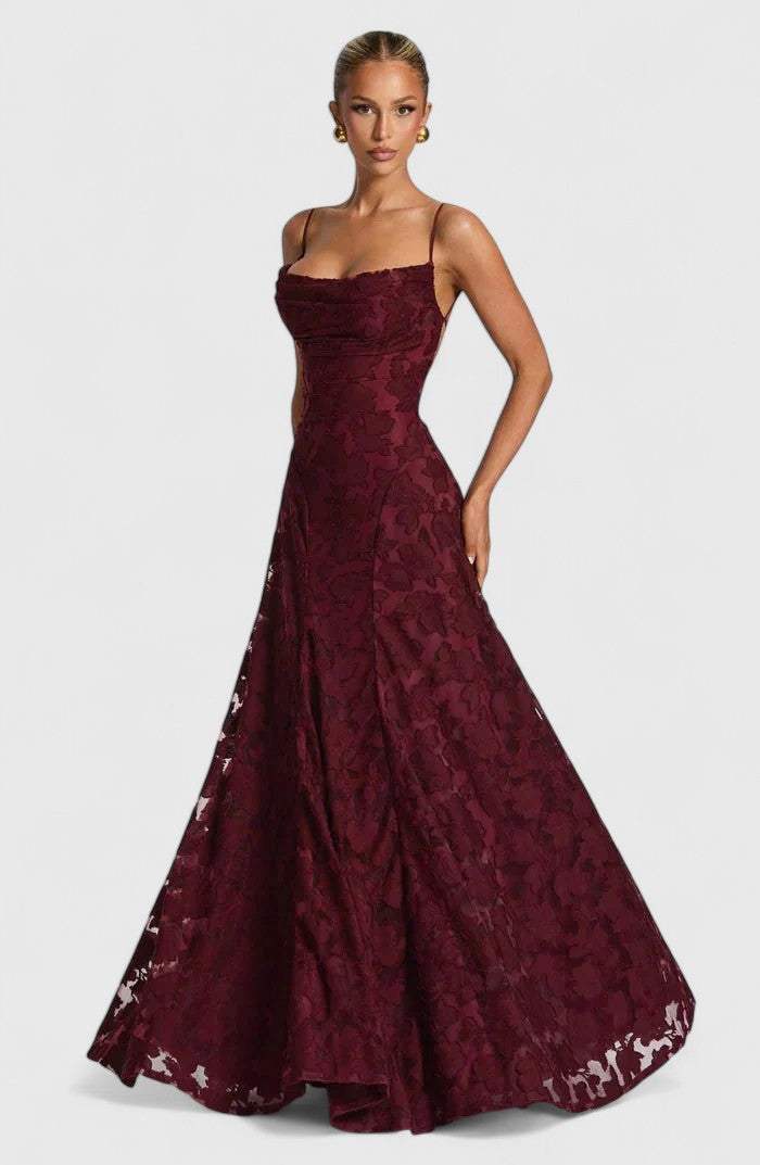 Full length view of a women's elegant flowy maxi dress, showcasing the open back and cowl neck design.