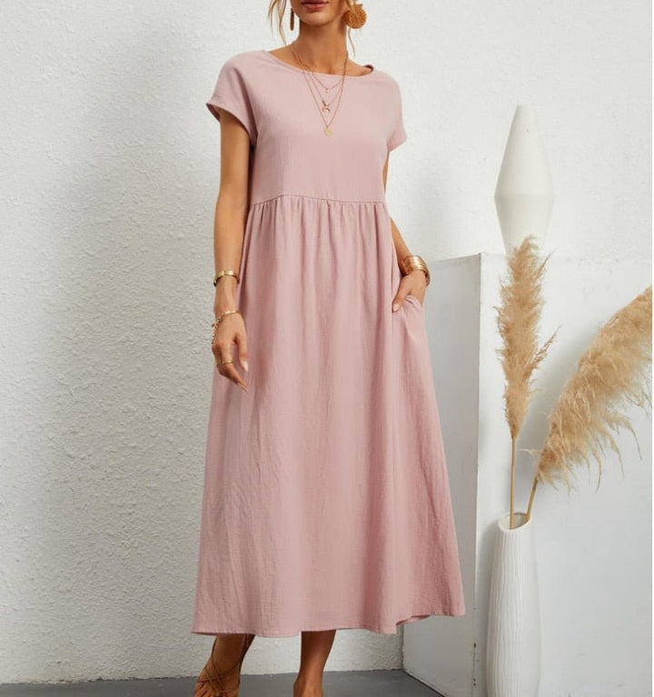 Elegant women's flowy maxi dress, a versatile summer piece for vacation, beach holidays, or relaxed wear.