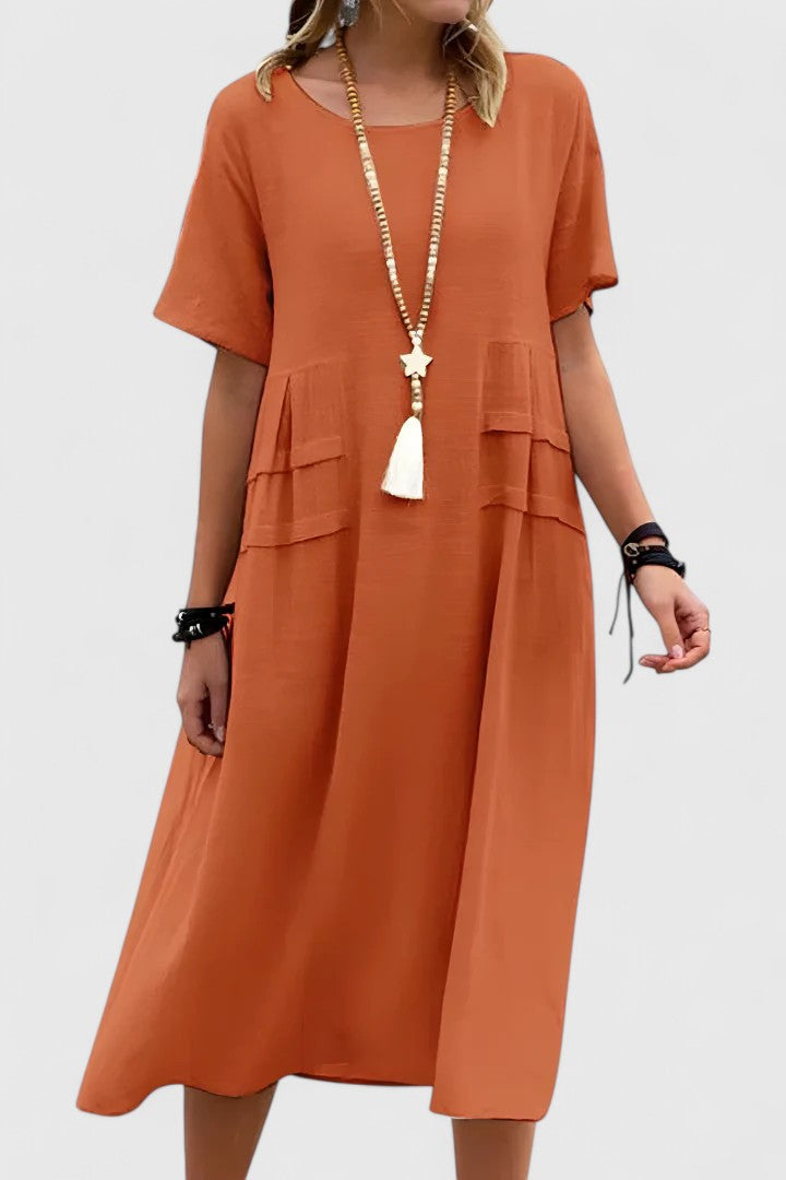 Elegant women's flowy midi dress in a vibrant color, perfect for summer occasions & day-to-night chic.