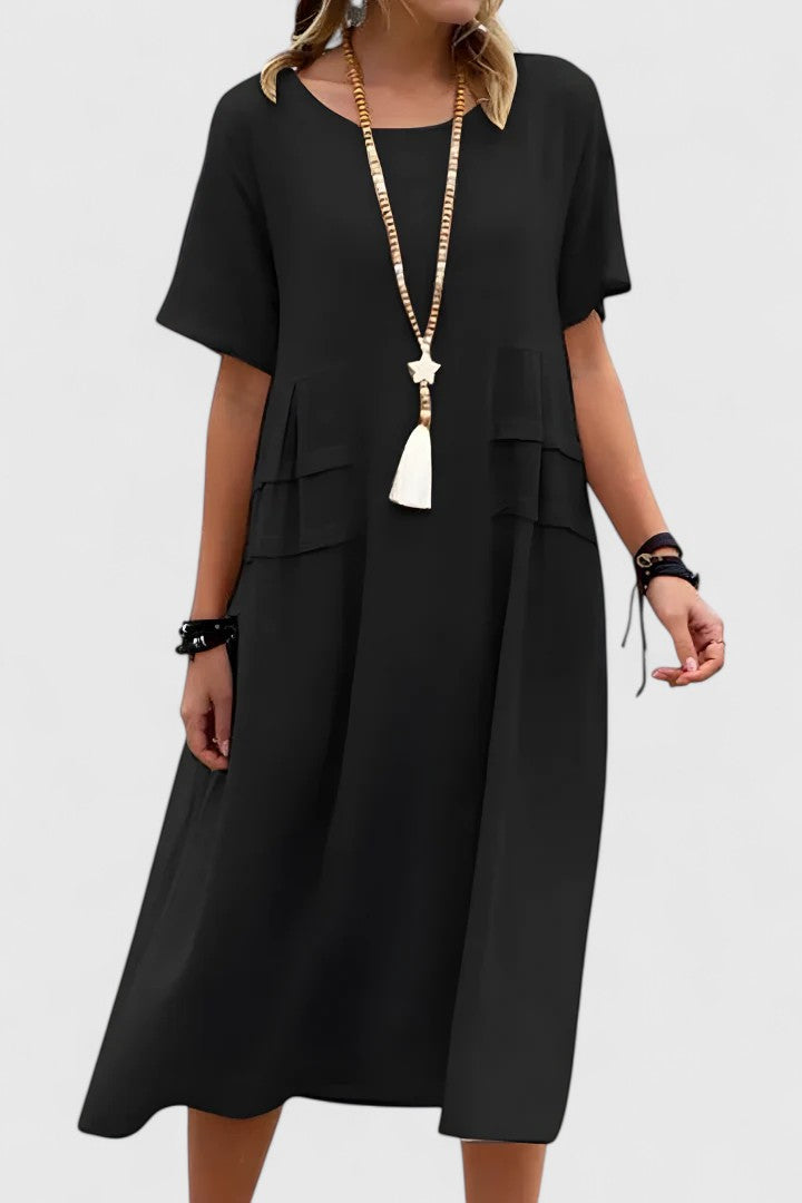 Beautiful women's flowy midi dress for summer, offering elegant style and comfort for various occasions.