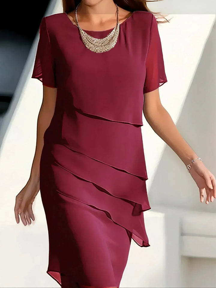 Versatile women's flowy short sleeve dress for summer. Day-to-evening style with an elegant design.