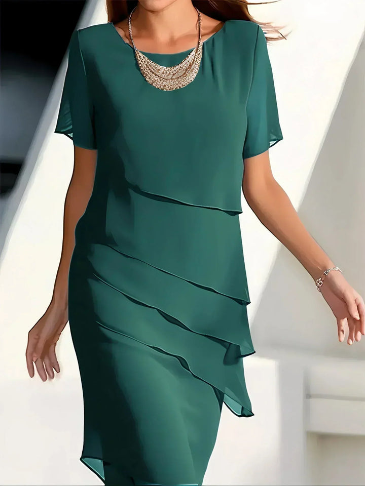 Khaki elegant flowy short sleeve dress for women. Chic, comfortable, and perfect for special occasions.