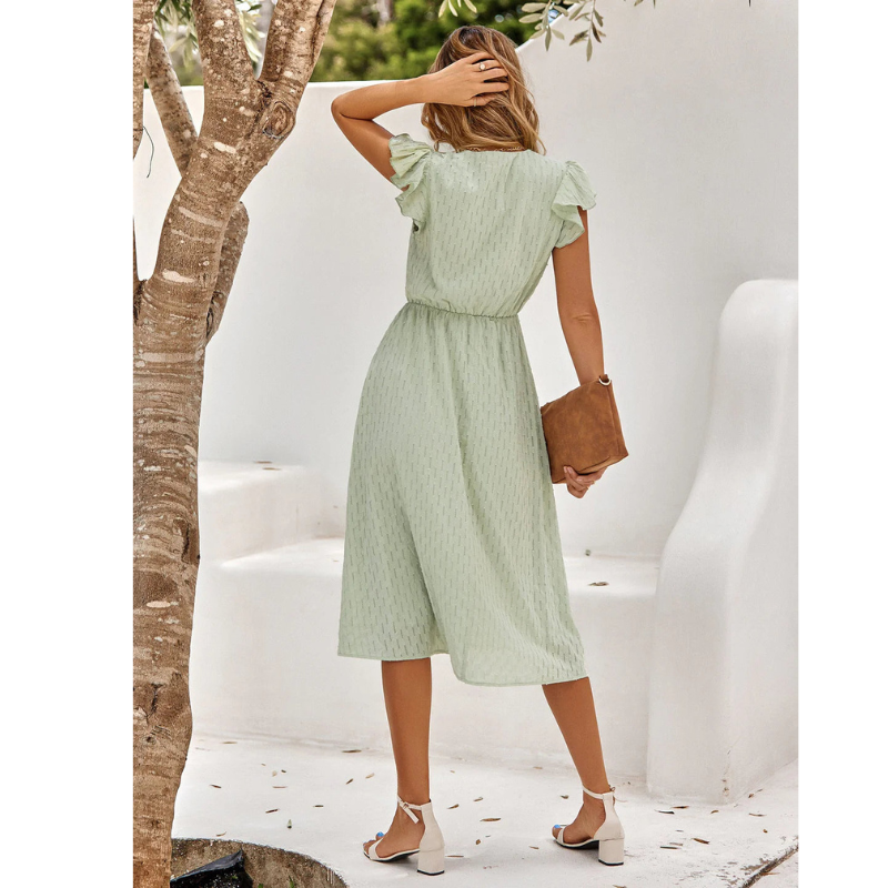 Effortless women's A-line midi dress with flutter sleeves, providing a relaxed and elegant style for spring/summer.