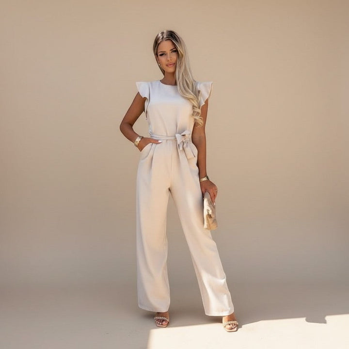 Formal women's jumpsuit, showcasing delicate flutter sleeves and a cinched waist tie detail.
