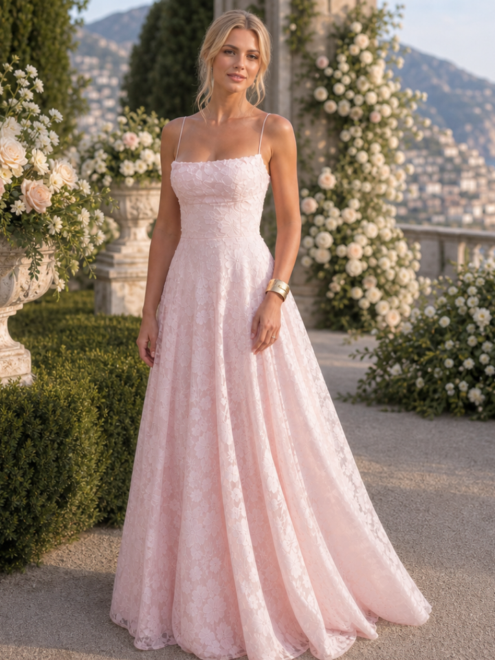 Flowing spaghetti strap maxi dress with elegant full overlay design for women, ideal for party wear.