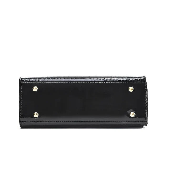 Modern design women's glossy purse. A fashionable statement bag for a sophisticated, elegant look.
