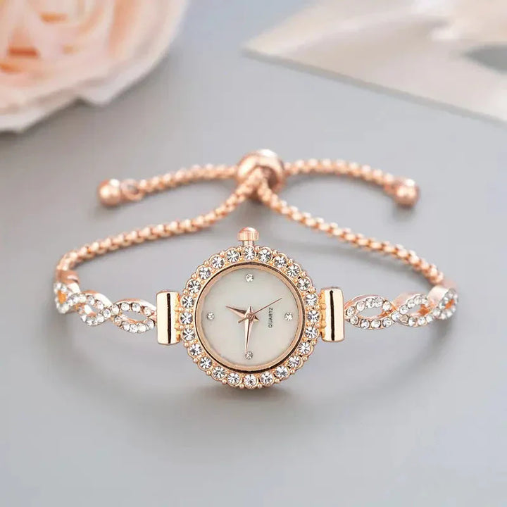 Elegant women's gold crystal bracelet watch, timeless luxury fashion accessory.