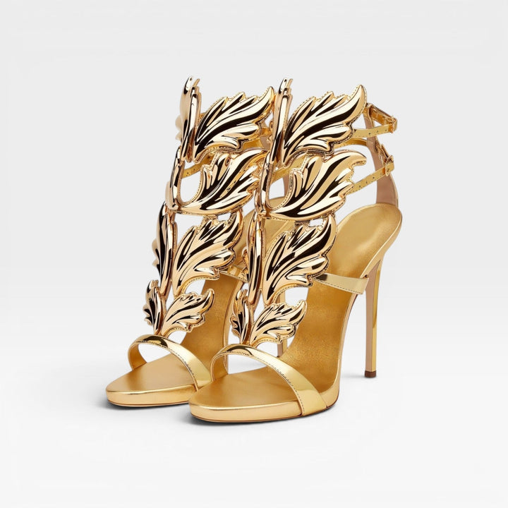 Luxurious gold evening heels for women, featuring a striking sculptural wing design.