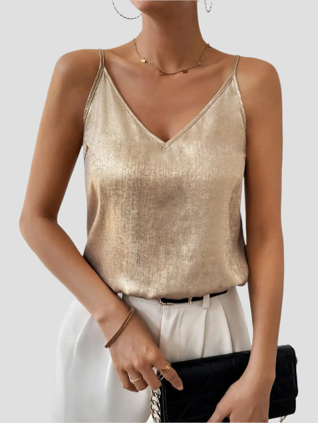 Elegant women's gold shimmer V-neck cami top with adjustable straps, perfect for evening wear & parties.