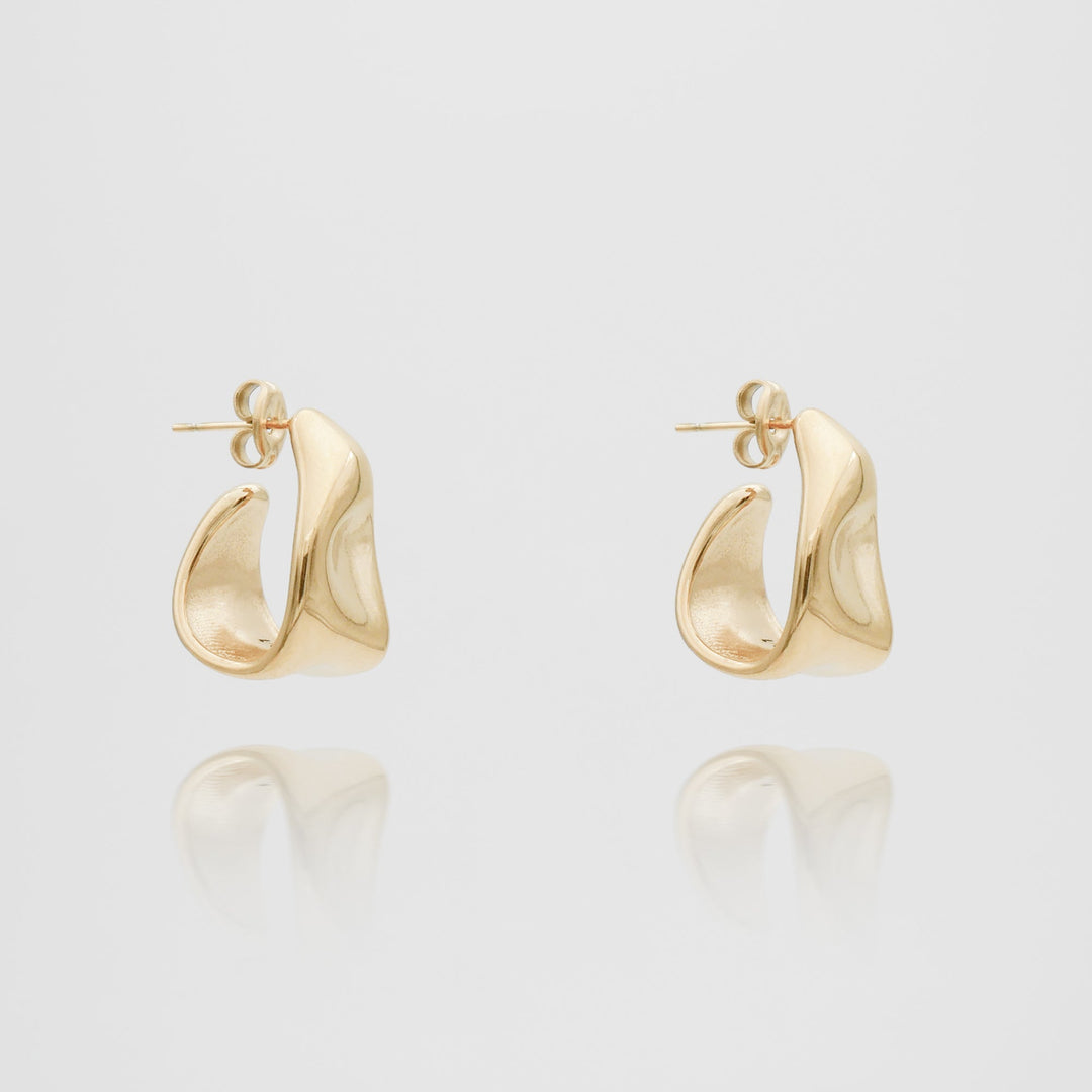 Elegant women's gold textured half hoop earrings, a chic fashion statement jewelry piece.