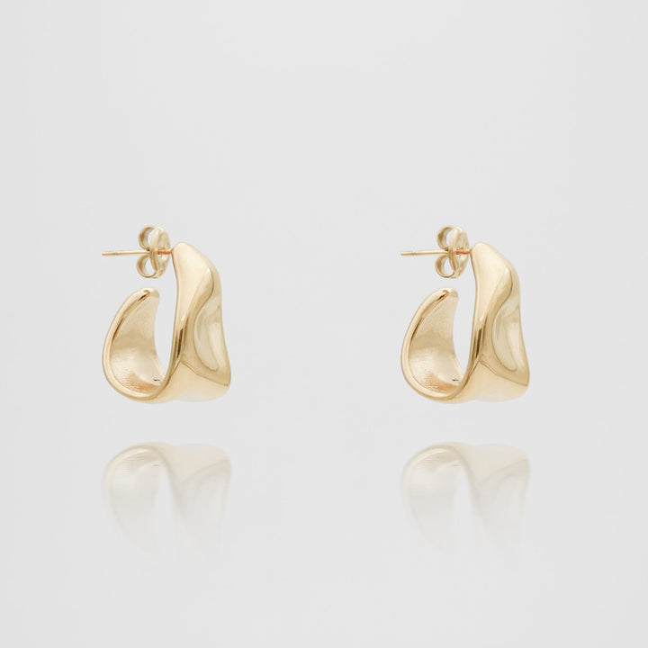 Elegant women's gold textured half hoop earrings, a chic fashion statement jewelry piece.