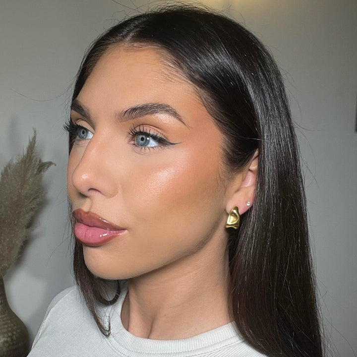 Stylish silver textured half hoop earrings for women, modern and elegant everyday accessory.