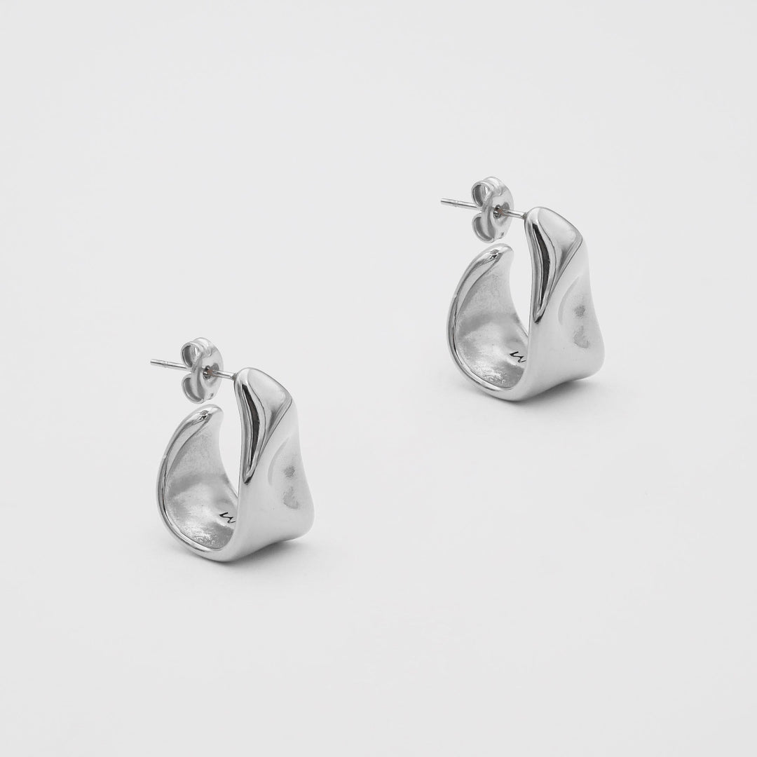 Fashionable women's half hoop earrings with a subtle textured gold and silver design, versatile.