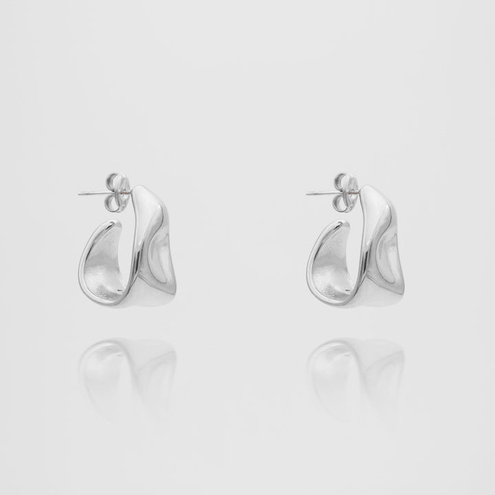 Statement textured half hoop earrings for women, crafted in elegant gold and silver tones.