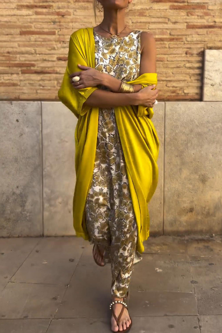 Elegant women's golden maxi dress, perfect for evening occasions and summer glamour. Flowy long design.