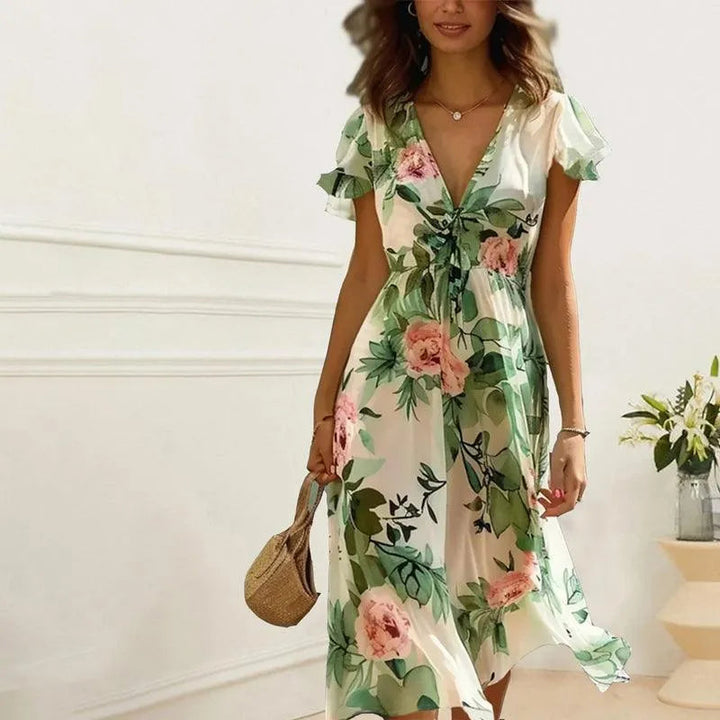 Bohemian A-line green floral midi dress for women, featuring stylish flutter sleeves. Ideal for elegant spring outfits.