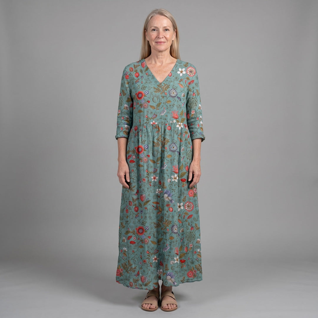 Elegant women's green floral summer midi dress, flowy & comfortable. Perfect casual vacation style.
